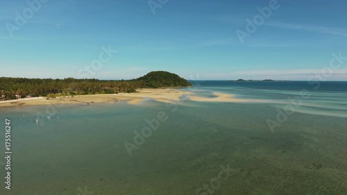 Top view of river, surrounded by trees, and small island wirh green trees. Summer river Ob in Siberia, view from the top. Flying above calm water, river and nature landscape. Areial view. photo