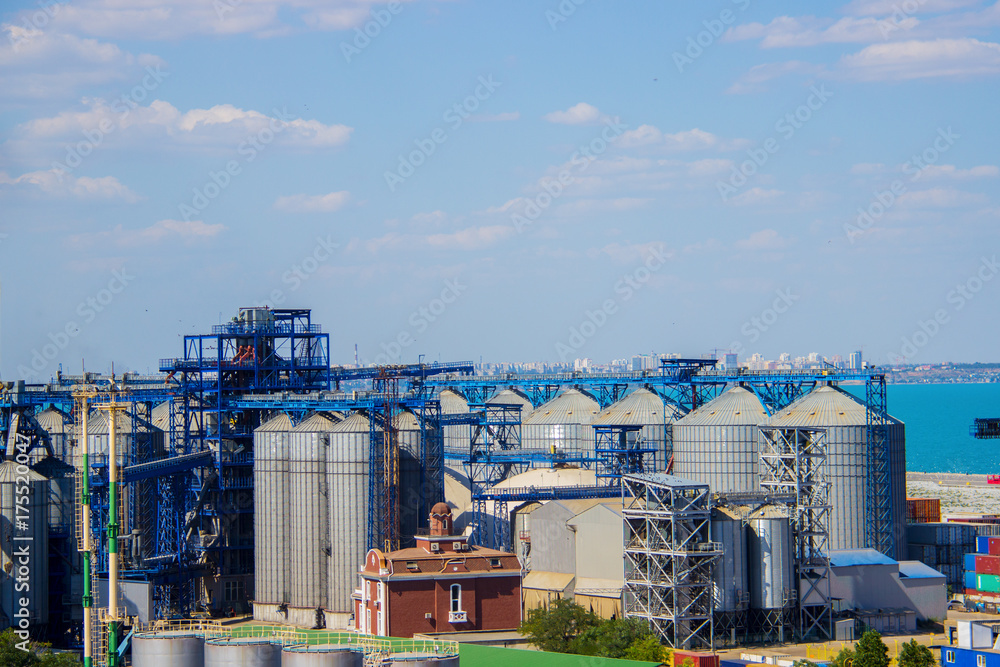 Port grain elevator. Industrial sea trading port bulk cargo zone grain terminal
