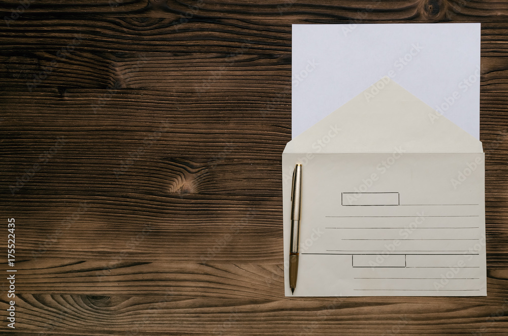 Letter on the wooden table. Paper envelope with copy space and pen. Contact us. Feedback. Letter on the wooden table. Paper envelope with copy space and pen. Contact us. Feedback.