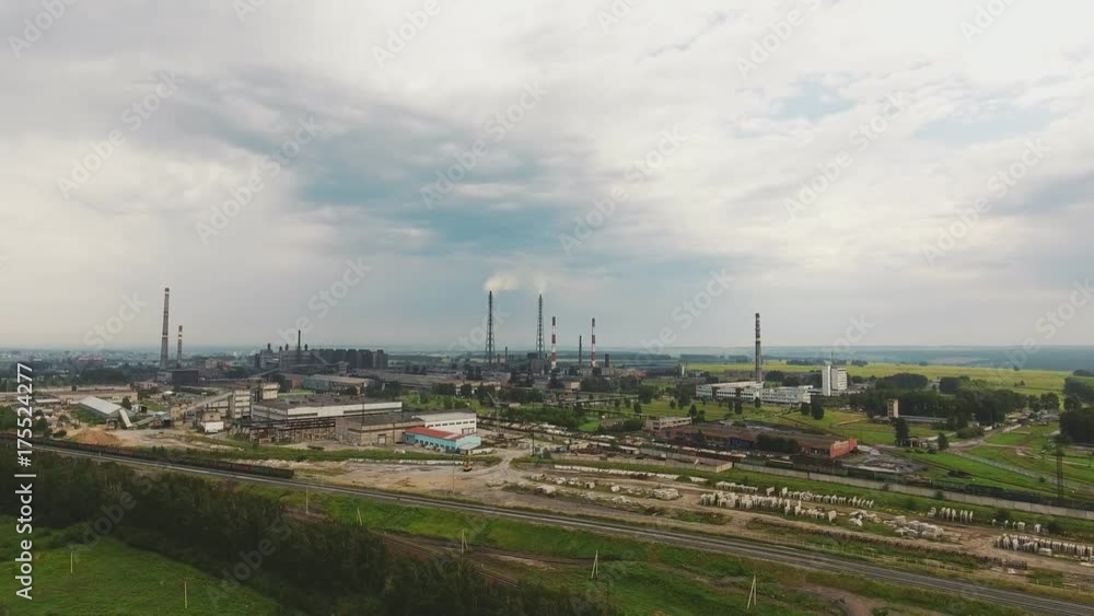 Industrial Zone, aerial view of pipe, railway, warehouse space. Bird view of large logistics center in industrial city zone from above. Factory chimneys and warehouses, industry district. Industrial Zone, aerial view of pipe, railway, warehouse space. Bird view of large logistics center in industrial city zone from above. Factory chimneys and warehouses, industry district.