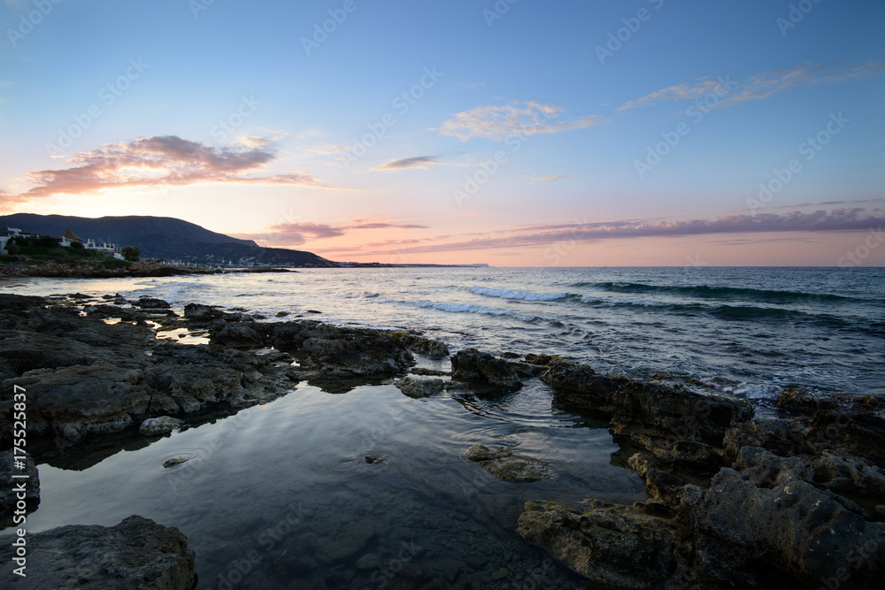 Sunset over the sea. Stalida, Crete, Greece. Autumn, the end of the tourist season. Sunset over the sea. Stalida, Crete, Greece. Autumn, the end of the tourist season.