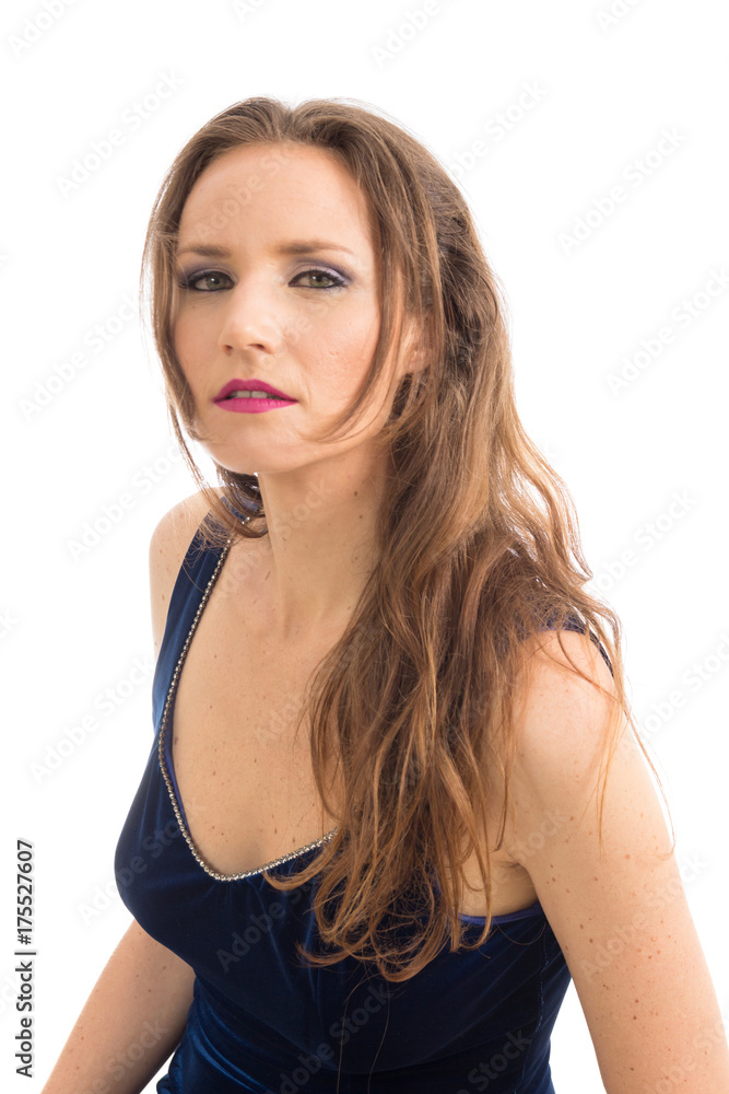 Woman with inquisitive look. Female model wearing elegant dress..