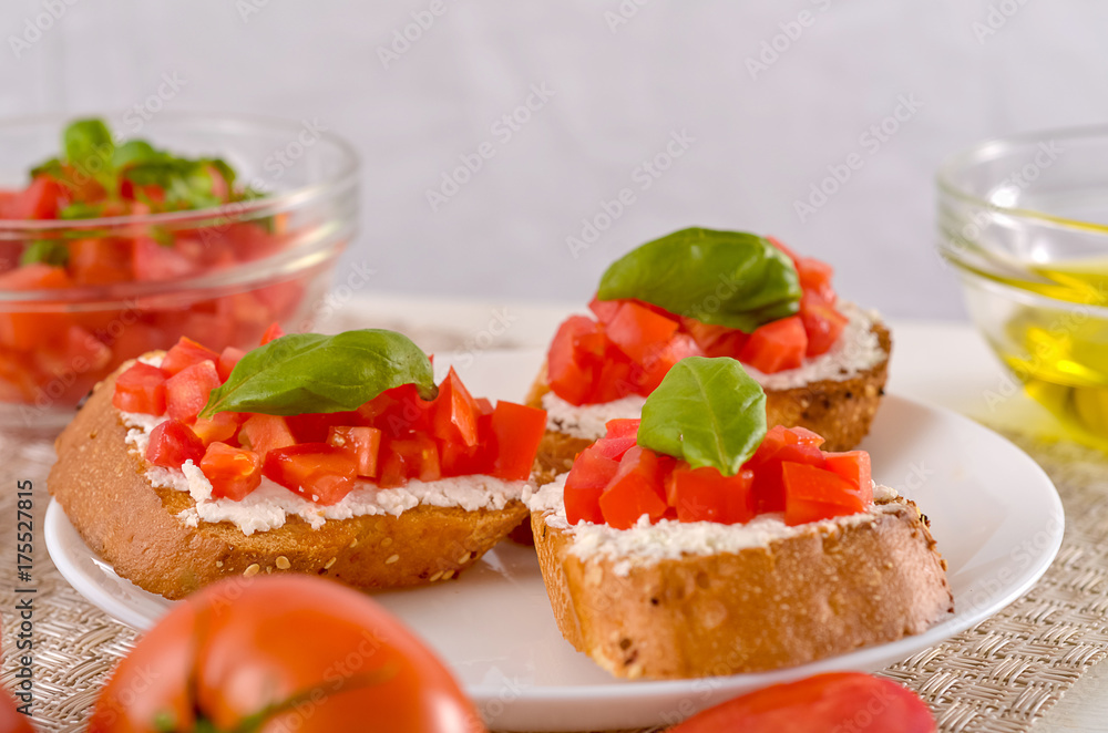 delicious bruschetta with tomatoes on plate on table close-up delicious bruschetta with tomatoes on plate on table close-up