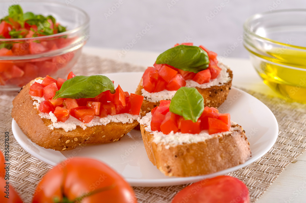 delicious bruschetta with tomatoes on plate on table close-up delicious bruschetta with tomatoes on plate on table close-up