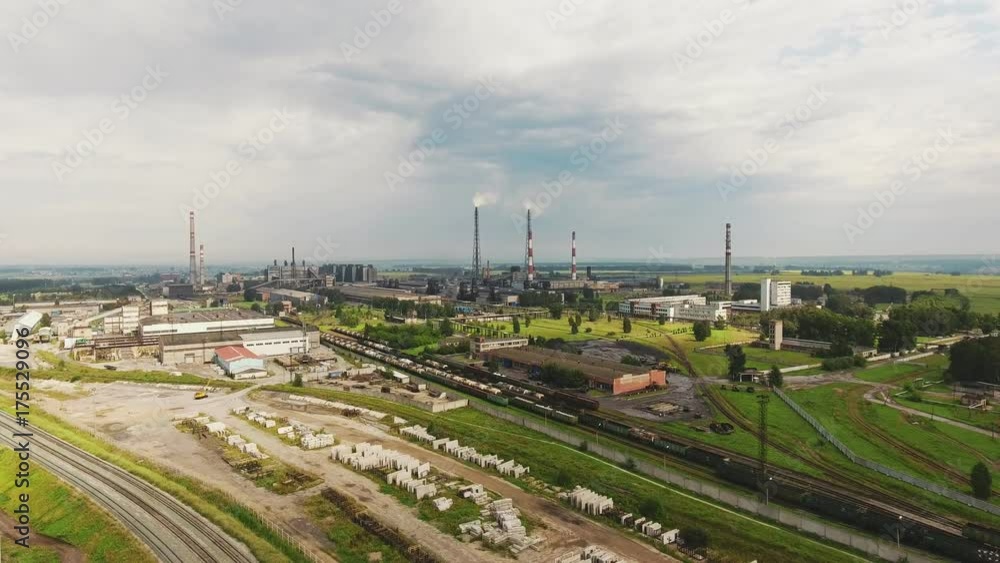 The urban landscape and the territory of the factory, production. Logistics center in industrial city zone from above. Industrial park zone from above, factory chimneys and warehouses. The urban landscape and the territory of the factory, production. Logistics center in industrial city zone from above. Industrial park zone from above, factory chimneys and warehouses.