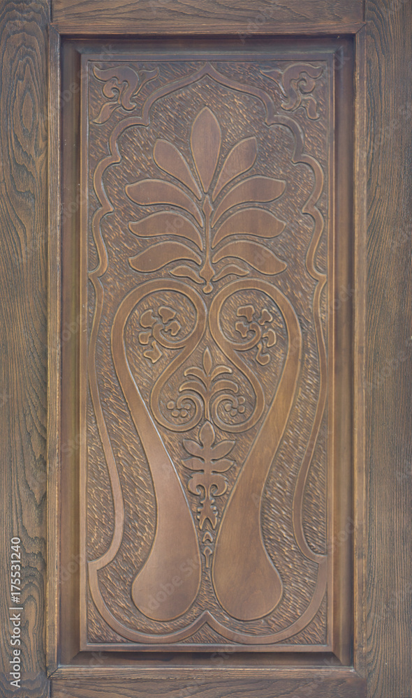 Vintage decorative wooden ornament on a door