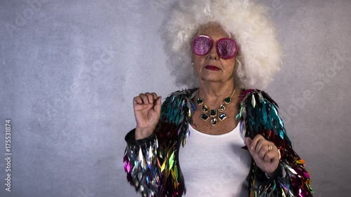 funky disco grandma dancing. cool older lady at disco event photo