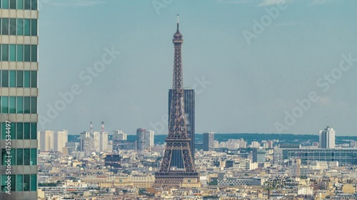 View of Paris and Eiffel Tower timelapse from the top of the skyscrapers in Paris business district La Defense photo