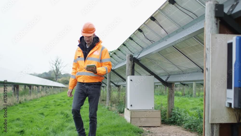 Technicians checking the electricity box at solar energy installation Technicians checking the electricity box at solar energy installation