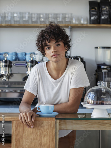 Portrait of beautiful young cofee shop owner photo