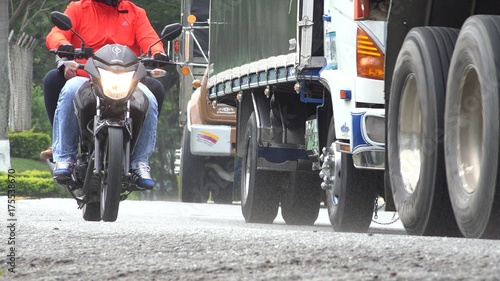 Motorcycle Riding With Trucks