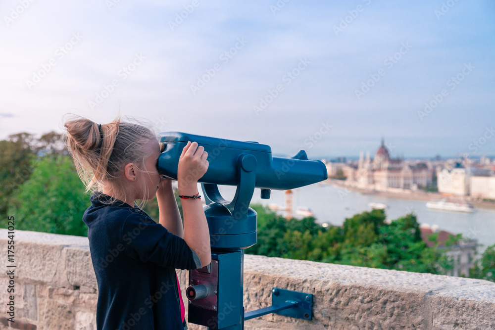 BUDAPEST, HUNGARY: Visitors view from Buda part city on Pest with Parliament building in frame