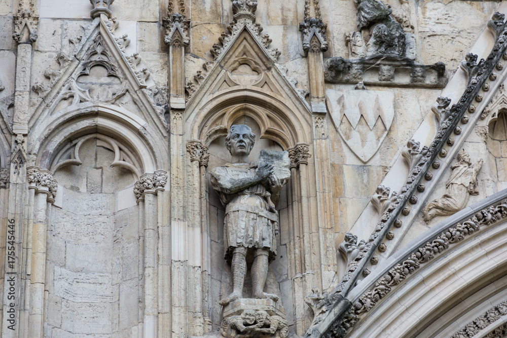 stone carving of a knight on cathedral wall