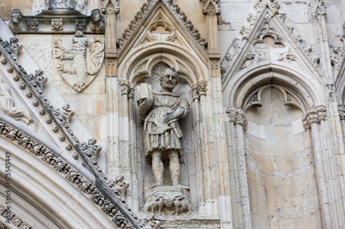 carved stone knight on a cathedral wall