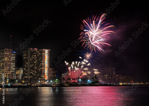 Viewing colorful fireworks from Magic Island, Honolulu, Hawaii © YiChen