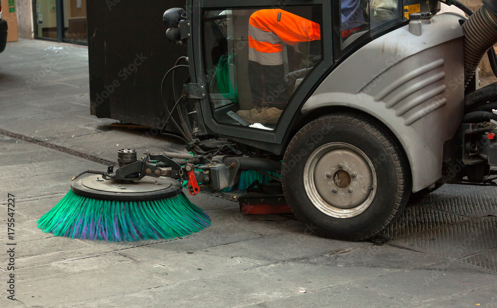 Street sweeper machine cleaning the streets Street sweeper machine cleaning the streets
