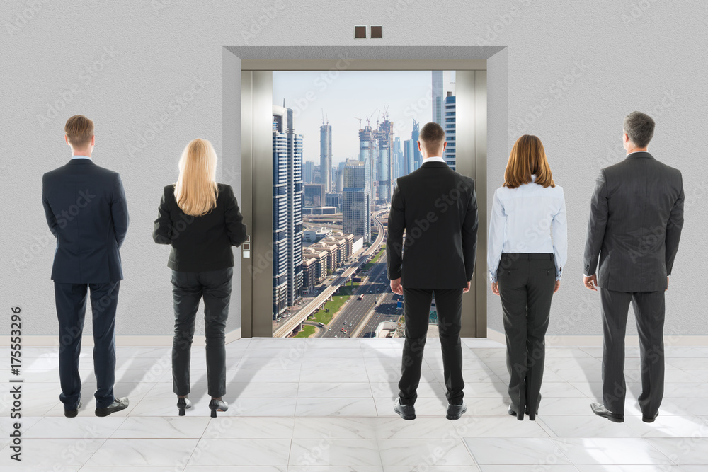 Fototapeta premium Businessman And Businesswoman Looking At Modern Elevator