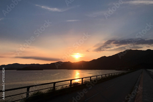 Road frame, footpath, sun and sunlight at sunset