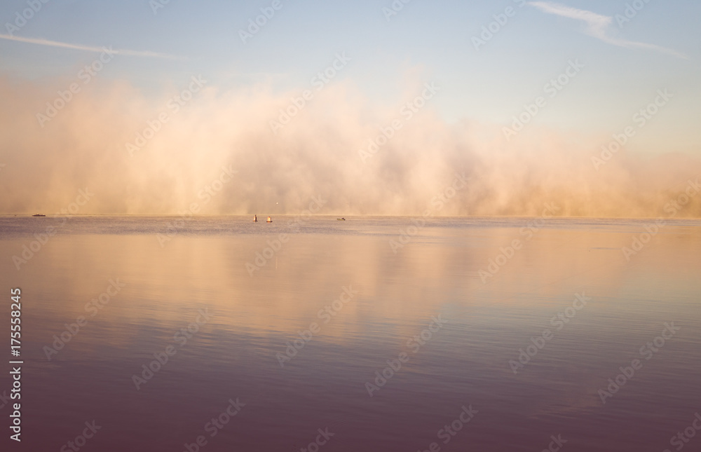 Fototapeta premium Sunrise on the river. Morning autumn fog
