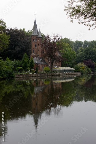 Gothic style building at Lake of Love, Minnewater Park, Bruges Belgium © Itsanan