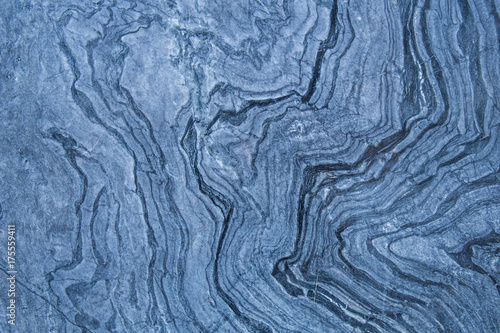 The pattern and surface of the blue, white and black marble walls for the background and tile design.