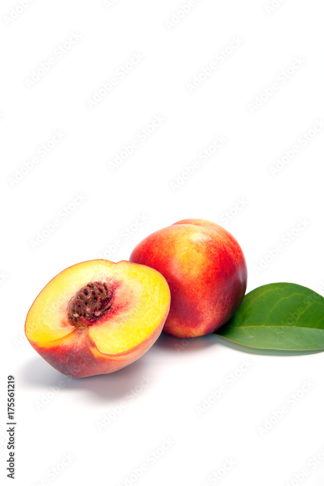 One and a half nectarine peaches isolated on white background One and a half nectarine peaches isolated on white background