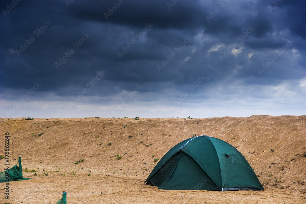 green tent at the beach