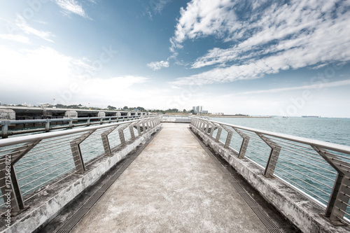 empty concrete footpath on sea © zhu difeng