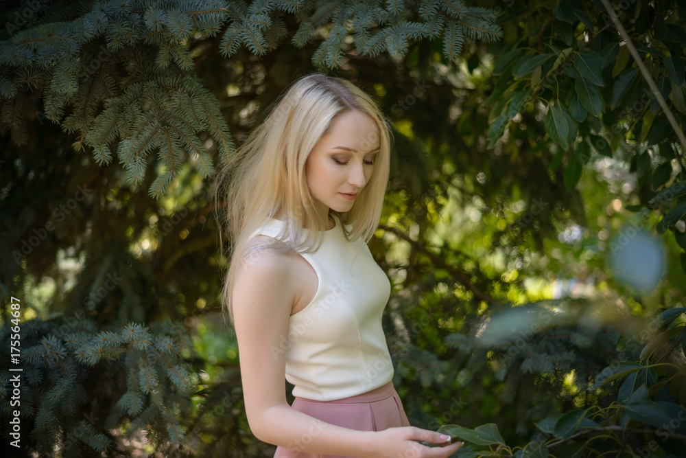 Outdoors portrait of beautiful young woman. Selective focus. Outdoors portrait of beautiful young woman. Selective focus.