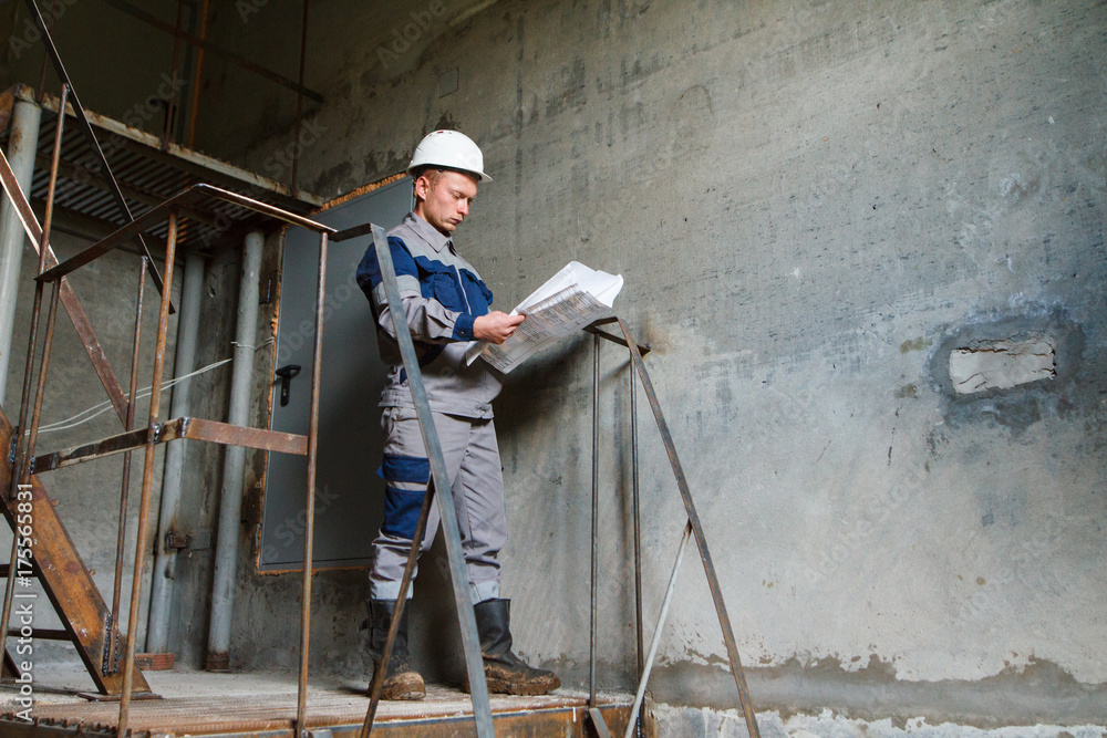 the builder looks at the drawings the builder looks at the drawings