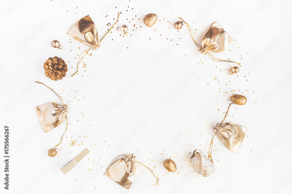 Christmas composition. Christmas gifts, pine cones, golden decorations on white background. Flat lay, top view, copy space