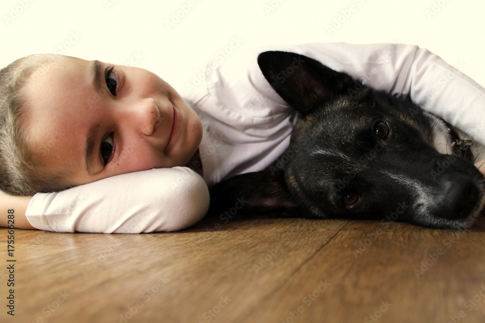 Obraz premium Little boy with dog isolated on white