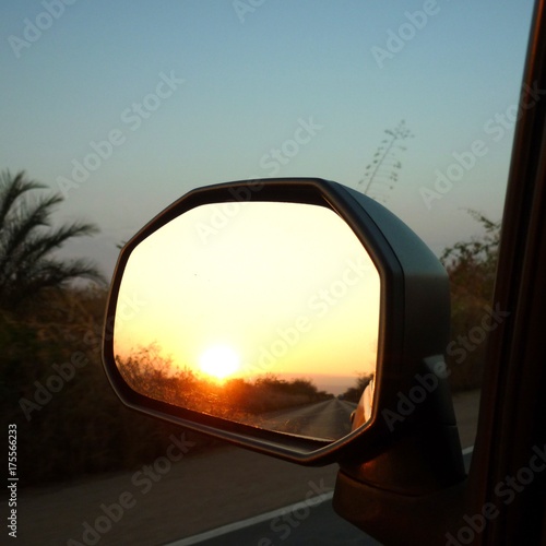 sun in the rearview mirror