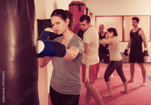 female  in kickboxing  gloves © JackF