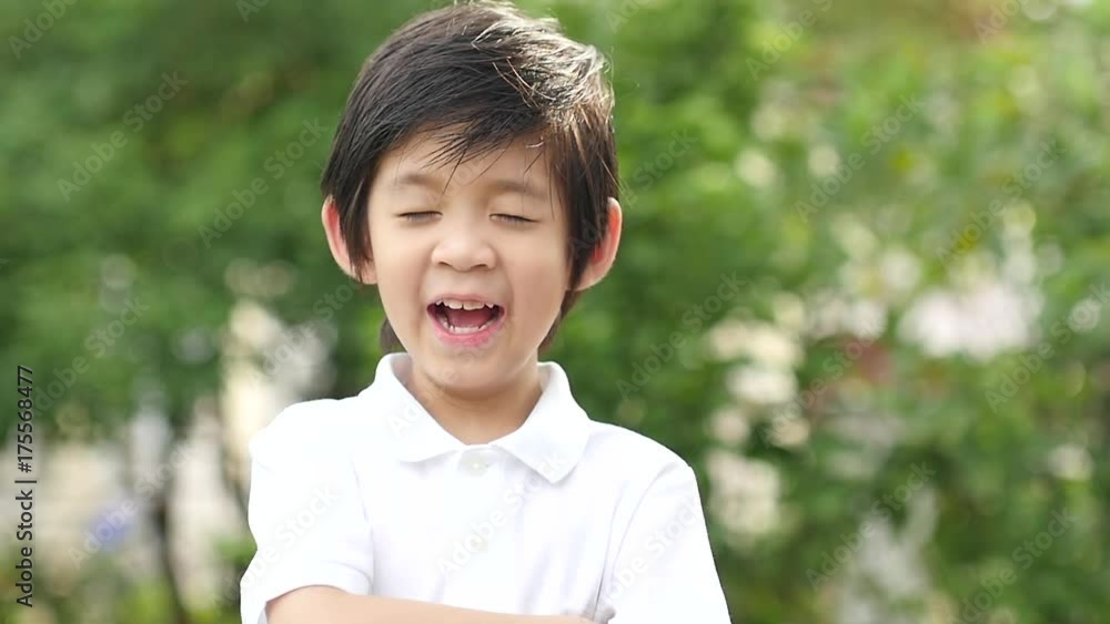 Close up of asian child yawning outdoors slow motion Close up of asian child yawning outdoors slow motion