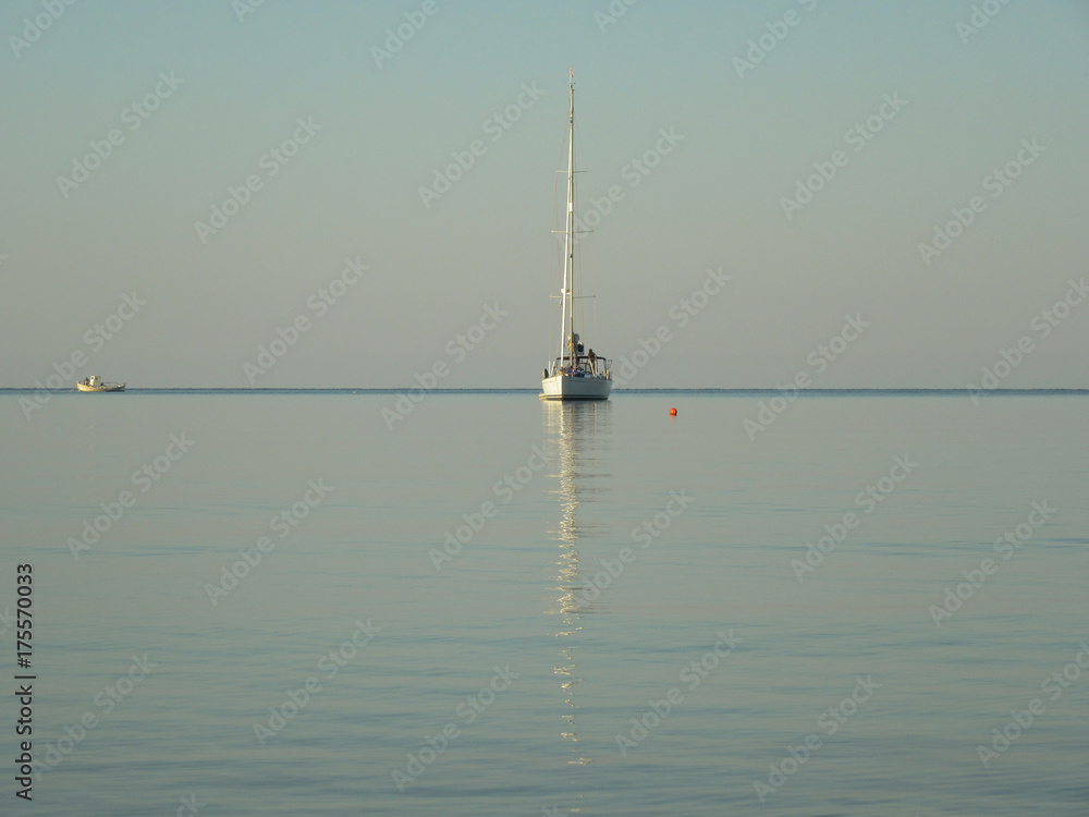 Reflection of a yacht in the sea. Reflection of a yacht in the sea.