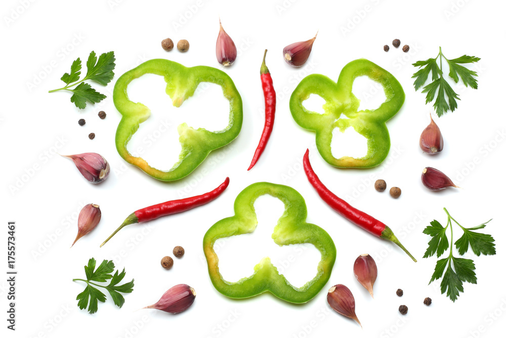 red hot chili peppers with parsley, garlic and cut slices of green sweet bell pepper isolated on white background top view red hot chili peppers with parsley, garlic and cut slices of green sweet bell pepper isolated on white background top view