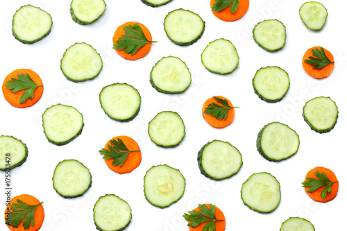 Fototapeta Naklejka Na Ścianę i Meble -  mix of sliced cucumber with sliced carrot isolated on a white background top view
