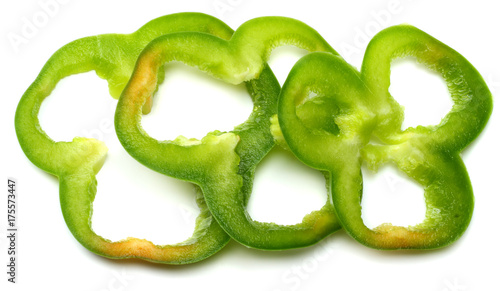 cut slices of green sweet bell pepper isolated on white background