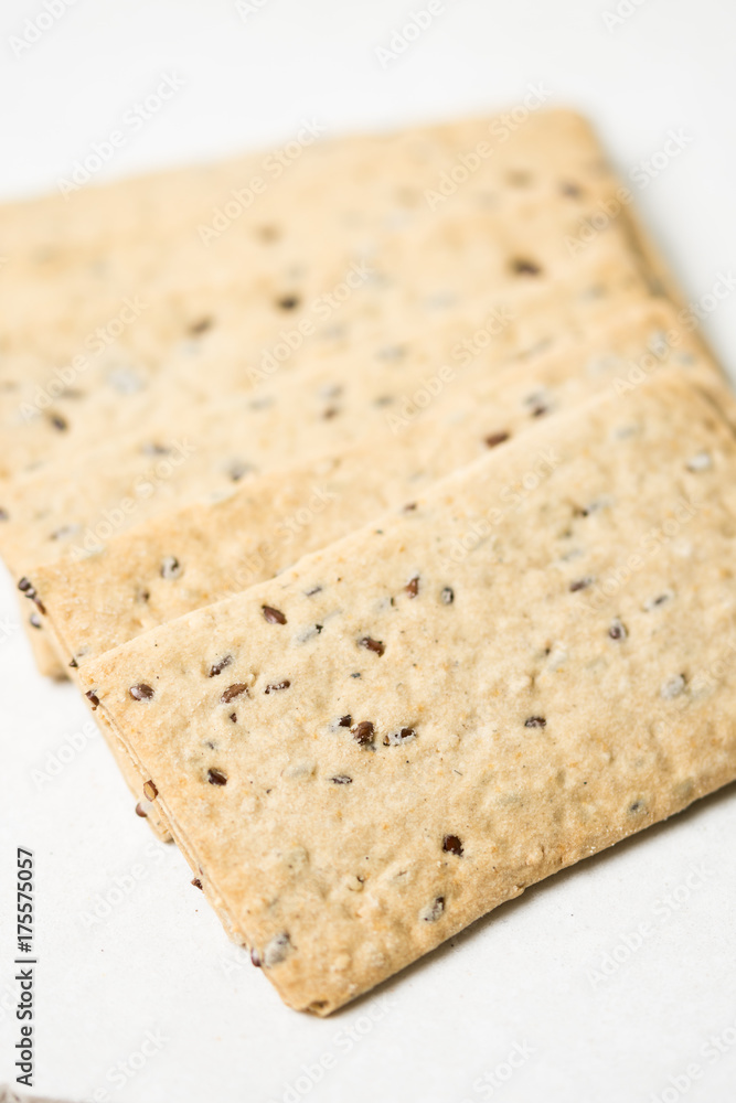 Flax chips isolated above white marble background table Flax chips isolated above white marble background table