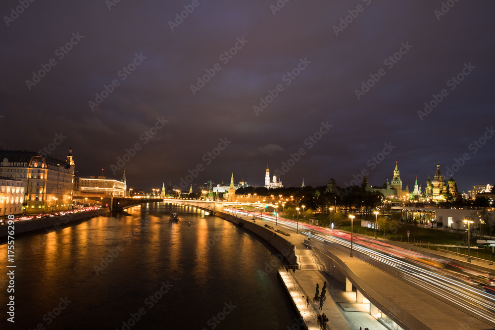 Beautiful View On Moscow Kremlin From Embankment Of Reflected Moscow River On Dramatic Sky At Autumn Night.