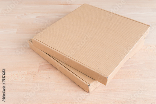 Cardboard box on a wood background