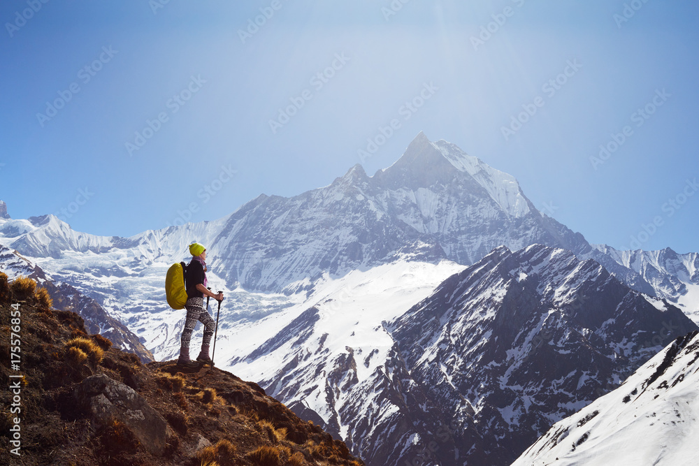 Girl on the background of mountain peaks
