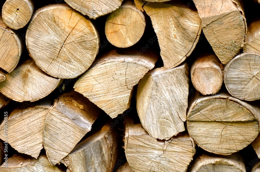 Abstract photo of a mixture of symmetric and asymmetric pile of natural wooden logs background, top view. Abstract photo of a mixture of symmetric and asymmetric pile of natural wooden logs background, top view.