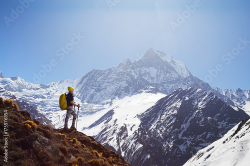 Girl on the background of mountain peaks 