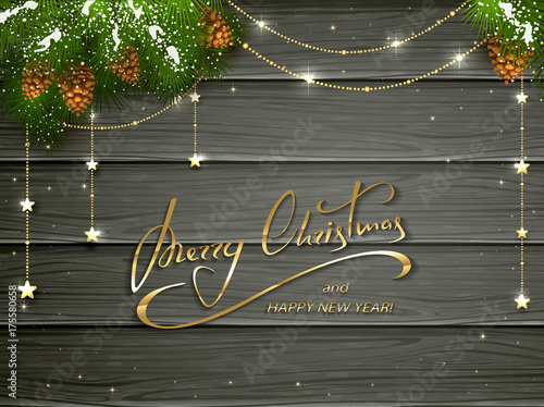 Merry Christmas and golden decorations on black wooden background