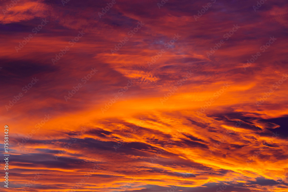 Amazing sky background with clouds in sunrise.