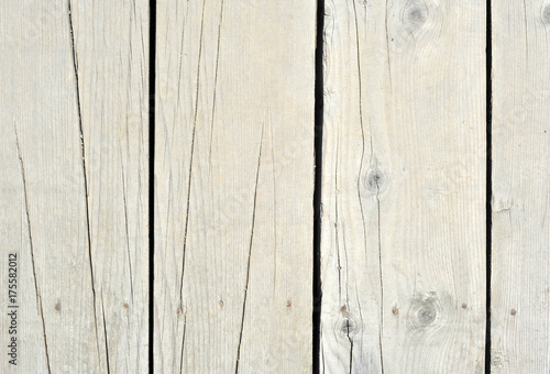 Beige old wood or wooden vintage plank floor or wall surface background decorative pattern. A minimal tabletop cover, simple material for retro or creative designs in constructions or furniture decor