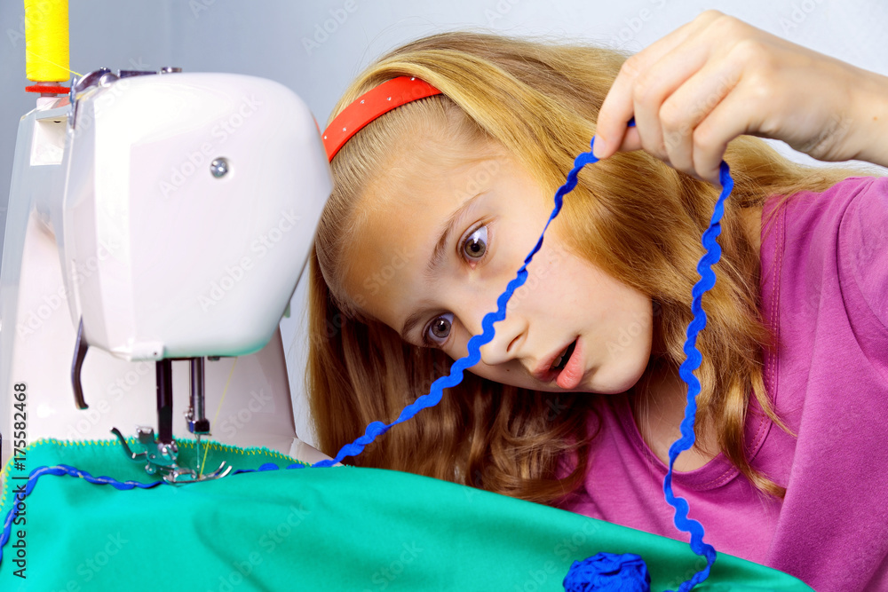 Teen girl frightened by her mistake when sewing