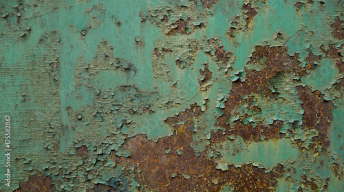 Old paint peeling on a rusty metal